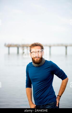 Portrait of smiling man on the beach, Rerik, Germany Stock Photo
