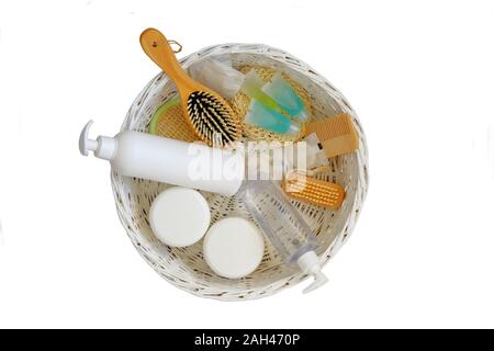 Natural cosmetics products. Cosmetic products for body and hair care and accessories in a white basket. Isolate on white background. Stock Photo