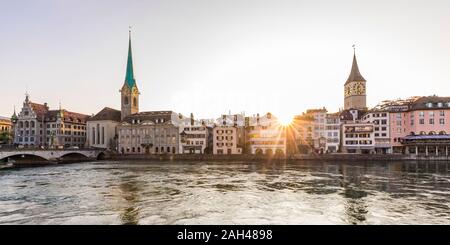 Switzerland, Canton of Zurich, Zurich, River Limmat and old town waterfront buildings at sunset Stock Photo