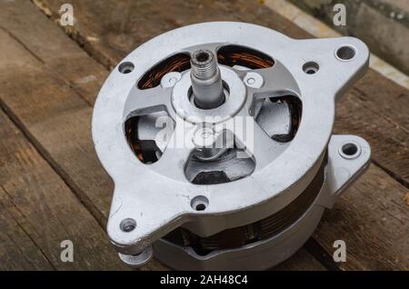Reconditioned auto generator. Close-up of a used generator after major repairs. First-class repair. Stock Photo
