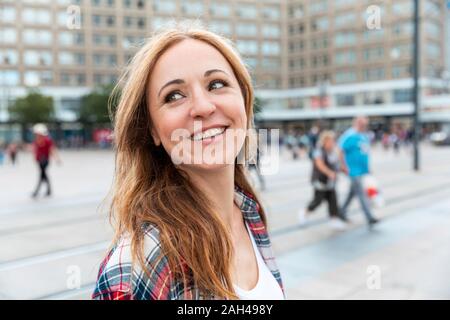 Portrait of a happy woman in the city, Berlin, Germany Stock Photo