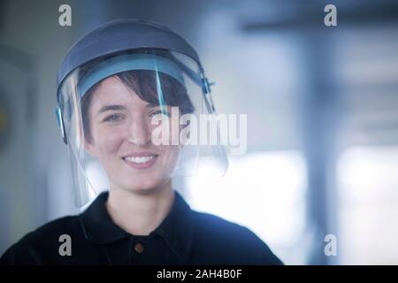 Portrait of female technician wearing safety helmet Stock Photo