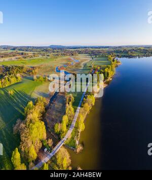 Germany, Bavaria, Uffing am Staffelsee, Aerial view of country road stretching between river Ach and shore of Staffelsee lake Stock Photo