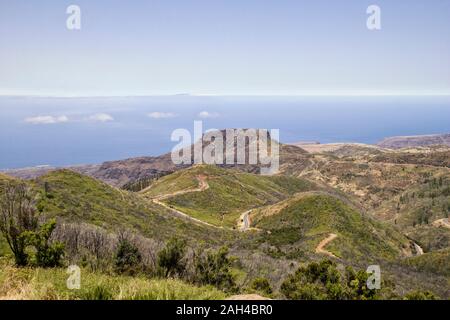 Spain, Canary Islands, La Gomera, Winding road in front of Table Mountain seen from summit of Garajonay Stock Photo