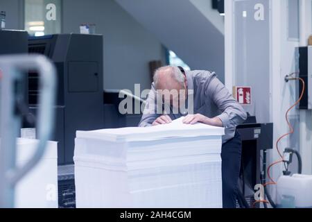 Manager working in printing house Stock Photo