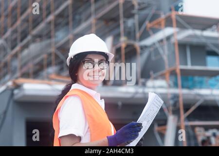 Female construction engineer checking the construction of a new house Stock Photo
