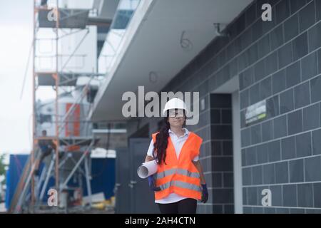 Female construction engineer checking the construction of a new house Stock Photo