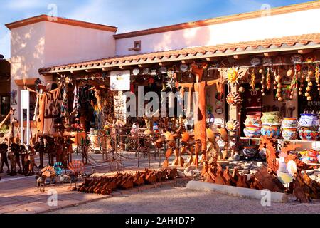 Glazed colorful Mexican pots, stonewear and metal sculptures outside Los Cantaros store in Tubac in Arizona Stock Photo