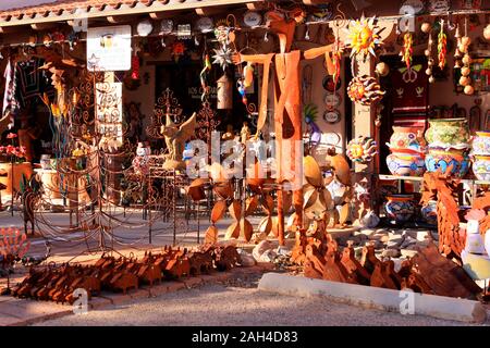 Glazed colorful Mexican pots, stonewear and metal sculptures outside Los Cantaros store in Tubac in Arizona Stock Photo