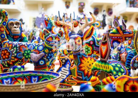 Traditional huichol bead ornament figures mexican culture work Stock Photo