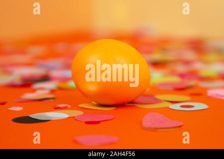 Easter composition of multicolored colorful easter eggs and feathers on pastel background. Happy Easter holidays. Stock Photo