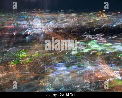 An abstract view of the lights of  Osaka at night, taken from the Sky Building, with induced camera movement used to create an abstract effect. Stock Photo