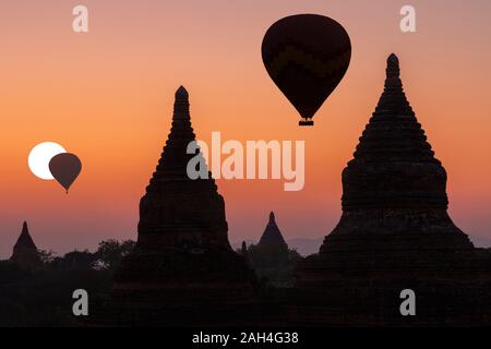 Hot air balloons over the pagodas at the sunrise in Bagan, Myanmar