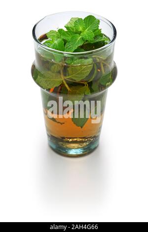 moroccan mint tea, green tea with a lot of spearmints isolated on white background Stock Photo