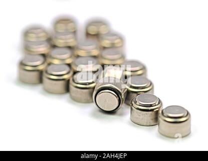 Hearing aid batteries in front of white background Stock Photo