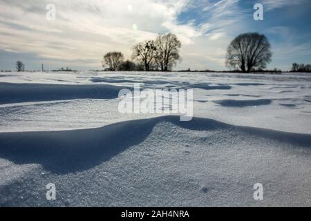 Snow drifts on the field in Nowiny, Poland