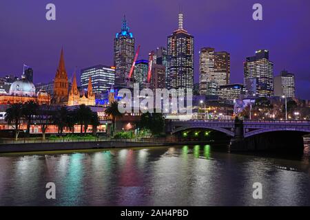 MELBOURNE, AUSTRALIA -15 JUL 2019- Night view of the downtown Melbourne City Centre skyline on the banks of the Yarra River in Melbourne, Victoria, Au Stock Photo