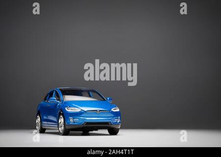 Izmir, Turkey - December 25, 2019: Front view of a blue colored  2017 Brand Tesla Model X 90D on a gray background. Stock Photo