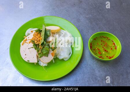 Vietnamese steamed rice pancake served with chili fish sauce Stock Photo