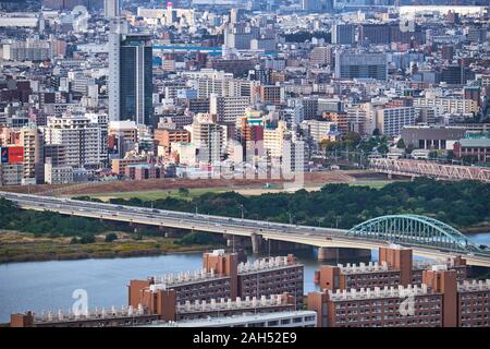 OSAKA, JAPAN - OCTOBER 15, 2019: The view of the city's skyscrapers in Umeda district  with the Juso-o bridge over  the Yodo River from the Umeda Sky Stock Photo