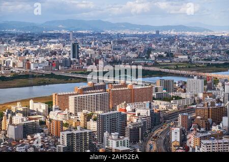 OSAKA, JAPAN - OCTOBER 15, 2019: The view of the city's skyscrapers in Umeda district  with the Juso-o bridge over  the Yodo River from the Umeda Sky Stock Photo