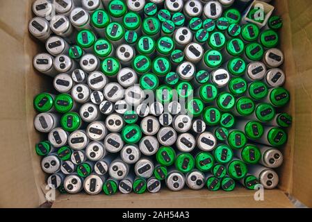Old fluorescent lamps are stacked in rows. Background view Stock Photo