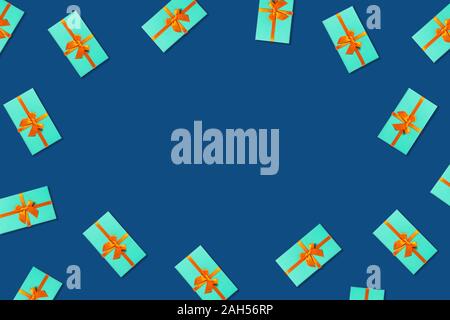 Pattern with group of mint holiday boxes on classic blue background. Flat lay, top view. Stock Photo