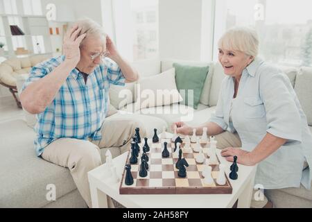 Portrait of his he her she two nice attractive cheerful cheery positive, intelligent people creating move pieces win winner amateur championship in li Stock Photo