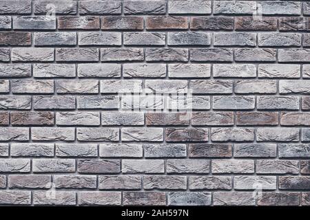 Brown brick wall texture. Gray grunge brickwork. Decorative tile surface. Bricks backgrounds. Messy wall pattern for wallpaper design. Concrete stone Stock Photo