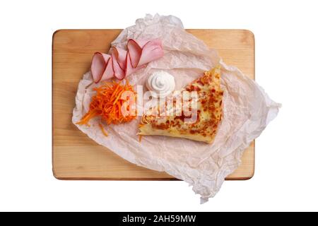Thin pancakes stuffed with ham and spicy carrot isolated on white Stock Photo