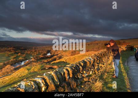 Teesdale, County Durham UK.  25th December 2019. UK Weather.  A photographer captures some beautiful early morning light on a cool but colourful Christmas day morning as cloud sweeps across Upper Teesdale. The forecast for northern England is for a dry day with plenty of sunny spells. Credit: David Forster/Alamy Live News Stock Photo