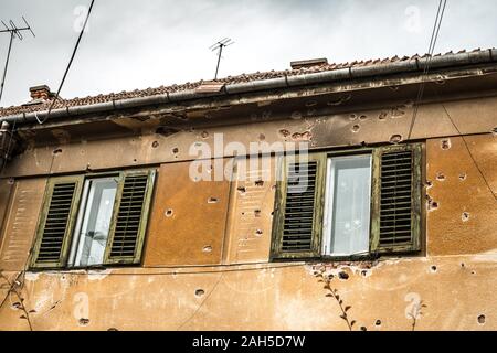 old building with bullet holes Stock Photo
