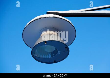 street lamp with snow and icicles in winter Stock Photo