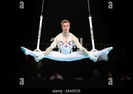 Szczecin, Poland, April 10, 2019: Stian Skjerahaug of Norway competes on the rings during the European artistic gymnastics championships