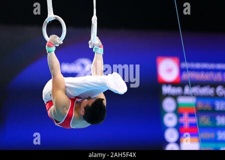 Szczecin, Poland, April 10, 2019: Yusof Eddy of Switzerland competes on the rings during the artistic gymnastics championships Stock Photo