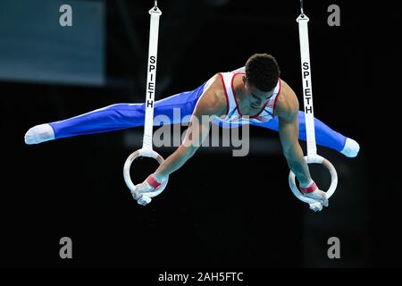 Szczecin, Poland, April 12, 2019: Loris Frasca of France competes on the rings during the European artistic gymnastics championships Stock Photo