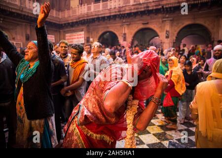 Hijra dancing inside Bankey Bihari temple during Holi celebrations