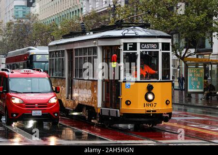 Vintage Milanese tram or heritage streetcar on Market Street on a rainy day in San Francisco, United States of America Stock Photo