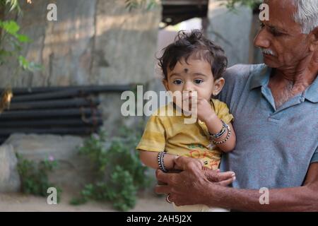 happy family grandfather and child on meadow with a kite in the summer on the nature,seervi, veer,suraram Stock Photo