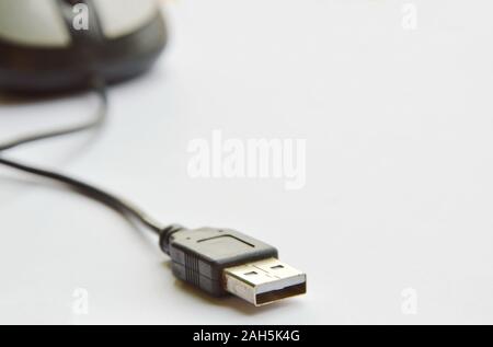 computer mouse and cable plug in on white background Stock Photo
