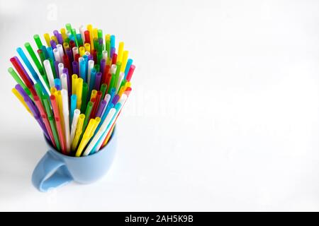 Background for a banner with plastic tubes in the cup. Frame for a banner with cocktail tubes. Party Banner Stock Photo