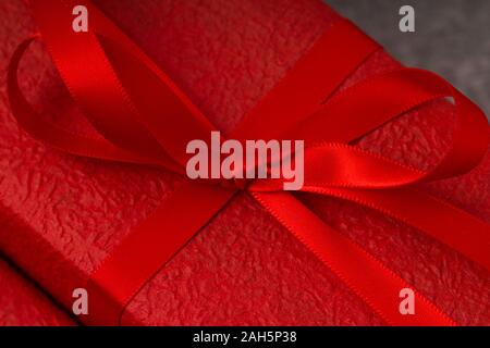 Close up of a red gift on concrete background Stock Photo