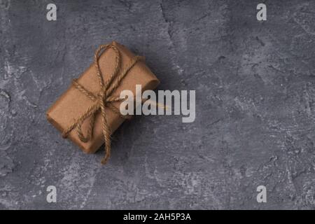 Gift boxes in craft paper on concrete background Stock Photo
