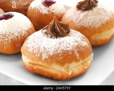 Delicious Hanukkah donuts with different fillings. Stock Photo
