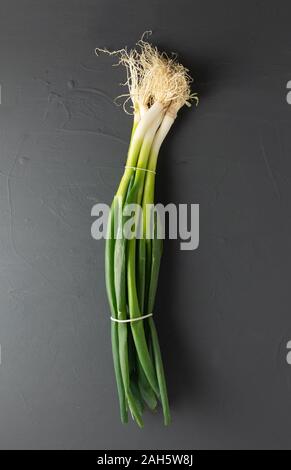 bunch of fresh young garlic on black background. isolated from the background Stock Photo