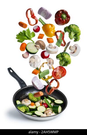 grilled fresh vegetables flying isolated on white background Stock Photo