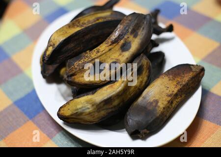 Boiled banana (pisang rebus) on the white plate. Stock Photo