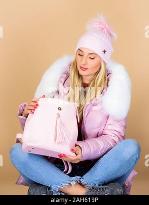 Little backpack and knitted hat. Total pastel outfit. Tender combination.  Matching accessories. Neutral color base. Pastel shades. Dreamy sweet  blonde girl. Girl wear outfit in pastel pink color Stock Photo - Alamy