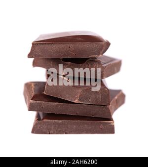 Chocolate pieces stack isolated on white background. Close up Stock Photo
