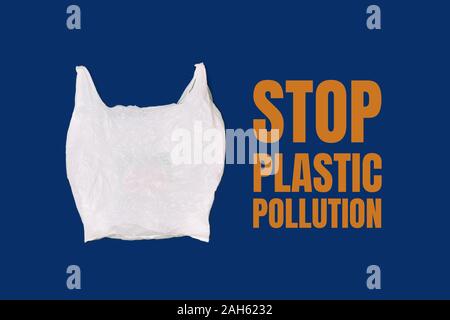 Empty white plastic bag on a blue background. Concept Stop plastic pollution, ecology, zero waste. Stock Photo